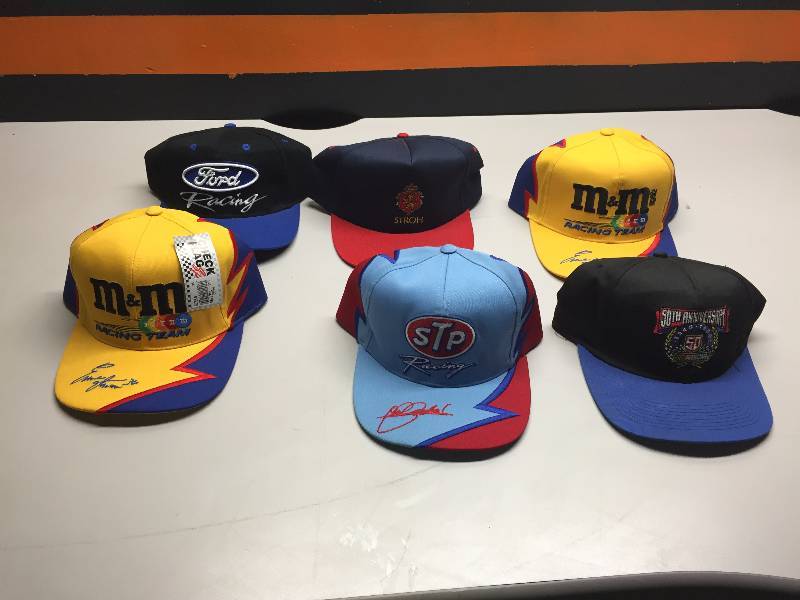 INTERSTATE BATTERY SIGN AND NASCAR CAPS (10)