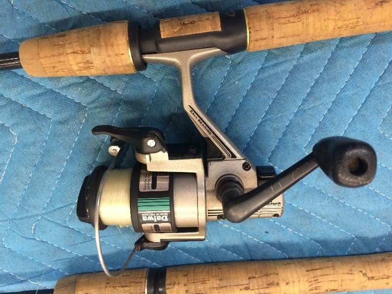 2 Rods and Reels - lightly used   view all pictures for more details