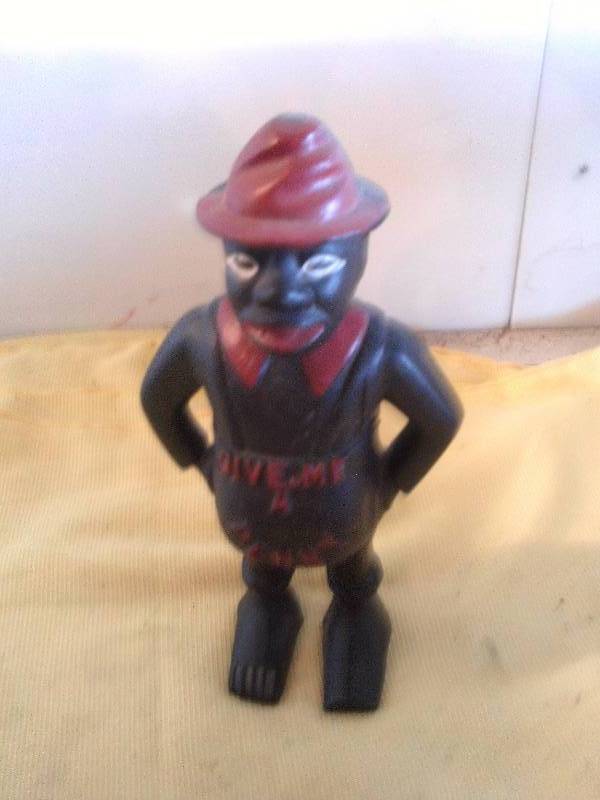 lot 5 image: GIVE ME A PENNY CAST IRON COIN BANK