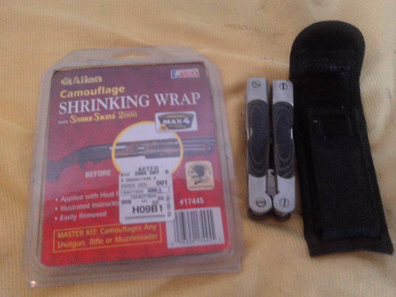lot 34 image: camo shrecking wrap and winchester multi tool