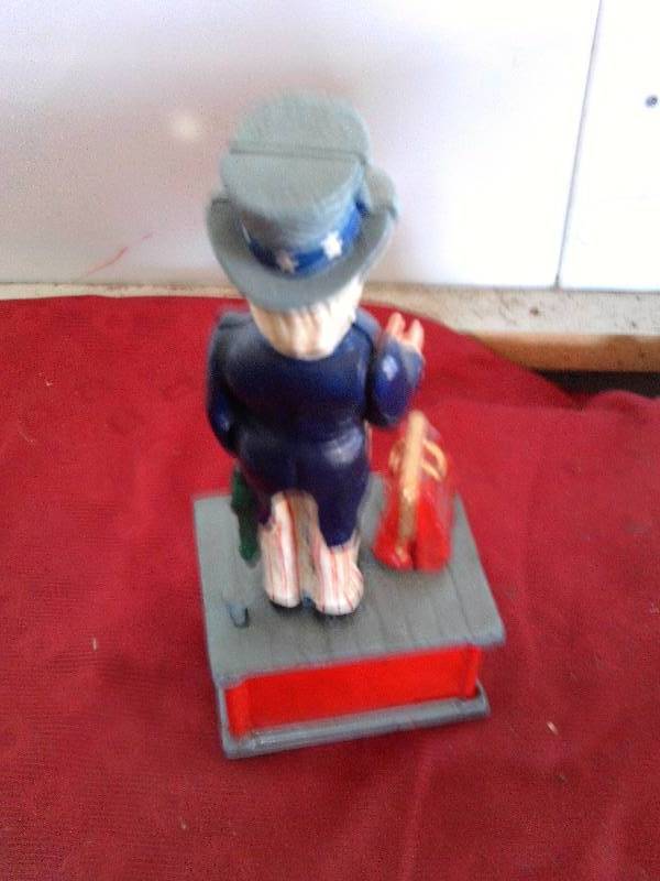 lot 122 image: COLLECTIBLE CAST IRON UNCLE SAM BANK