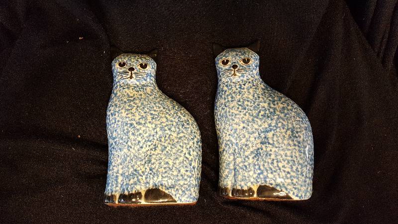 Two blue ceramic cats
