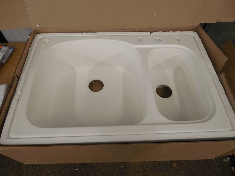 lot 33 image: Dual Mount Composite 33x22x9 in. 4-Hole LargeSmall Double Bowl Kitchen Sink in White