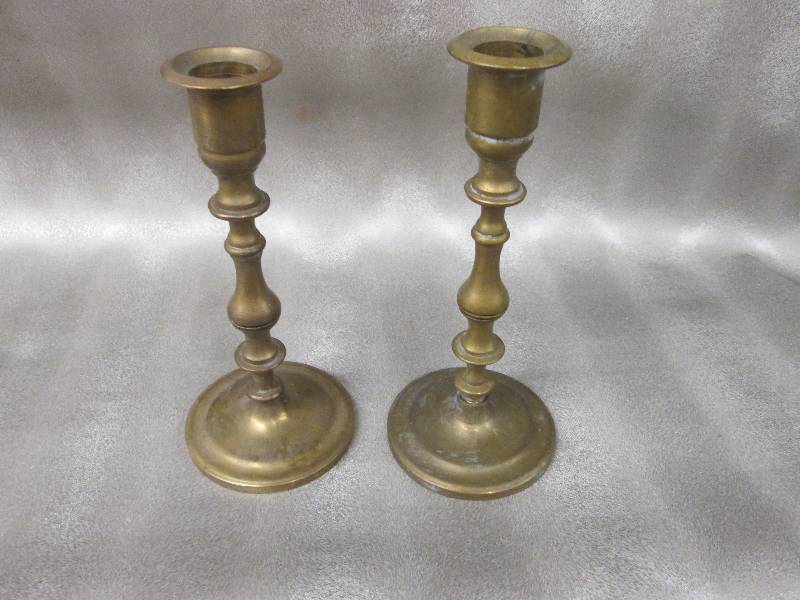 lot 9 image: Pair of brass candle holders...