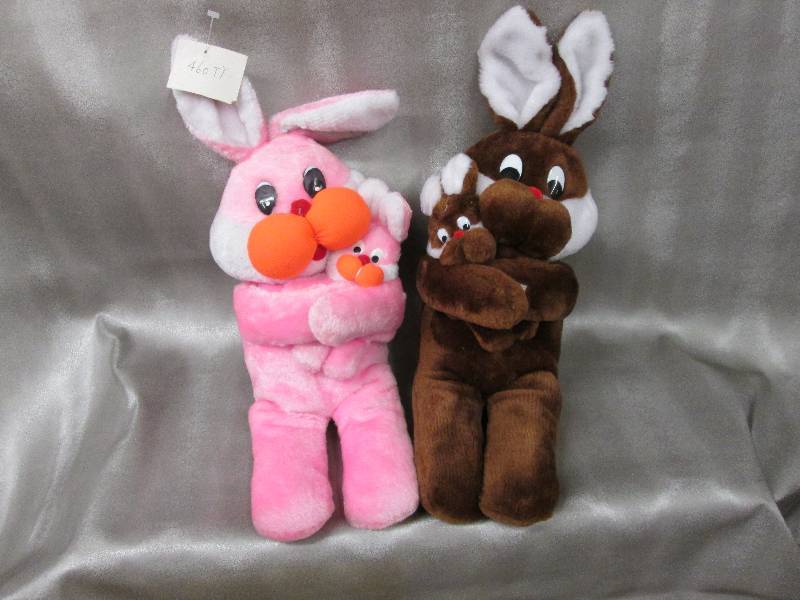 lot 33 image: Brown and Pink Plush Bunnies with b...