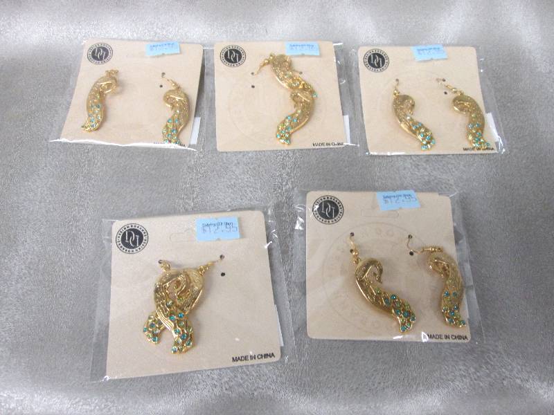 lot 61 image: Lot of 5 gold toned peacock earring...