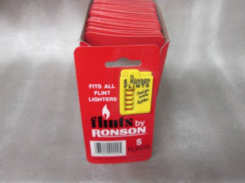 lot 99 image: Box of 24 Ronson 5 Flints per card...