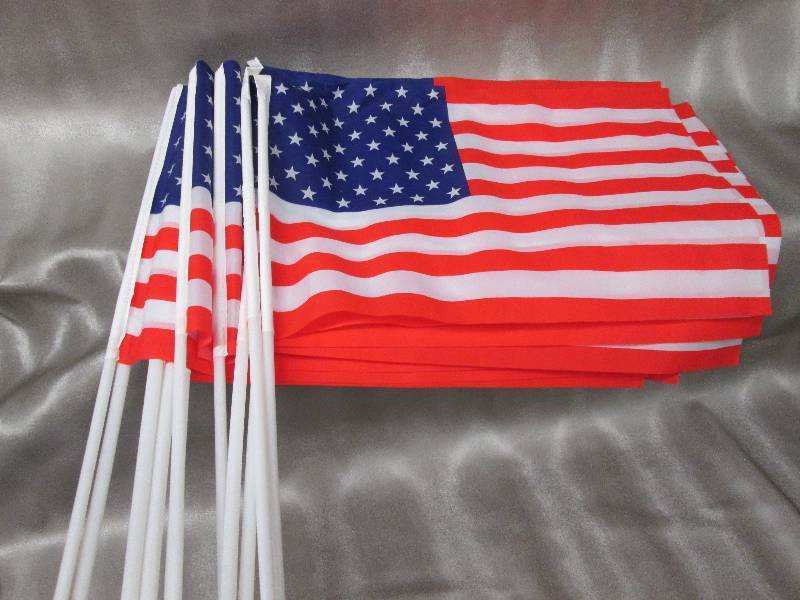 lot 156 image: Lot of 12 American Flags with plast...