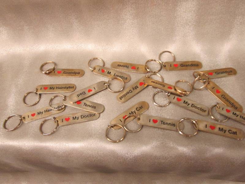 lot 212 image: Lot of I Love keychains...
