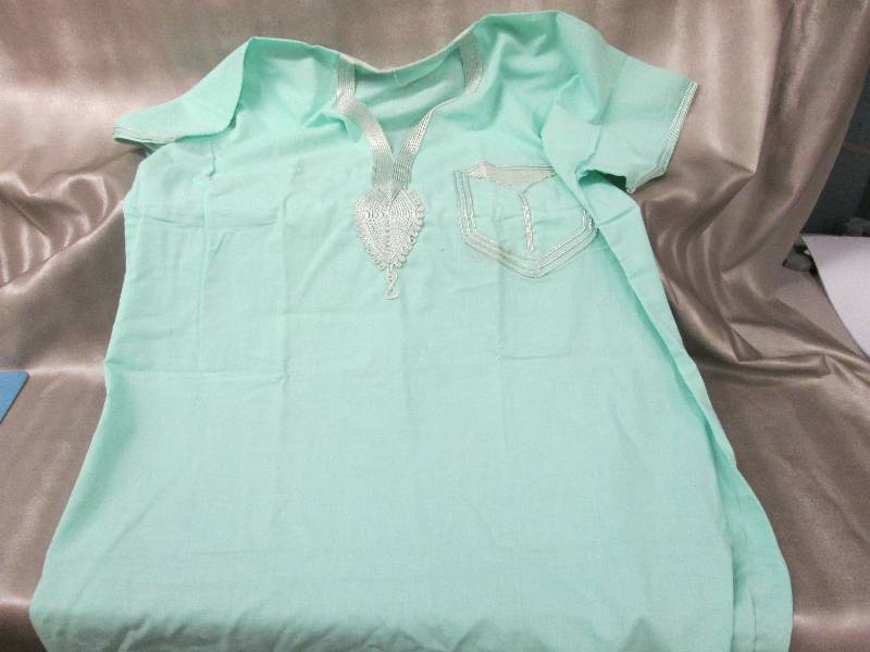 lot 231 image: Mint green Egyptian dress...