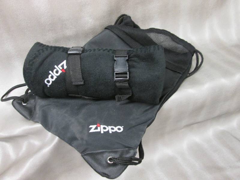 lot 276 image: Zippo tote with stadium blanket...
