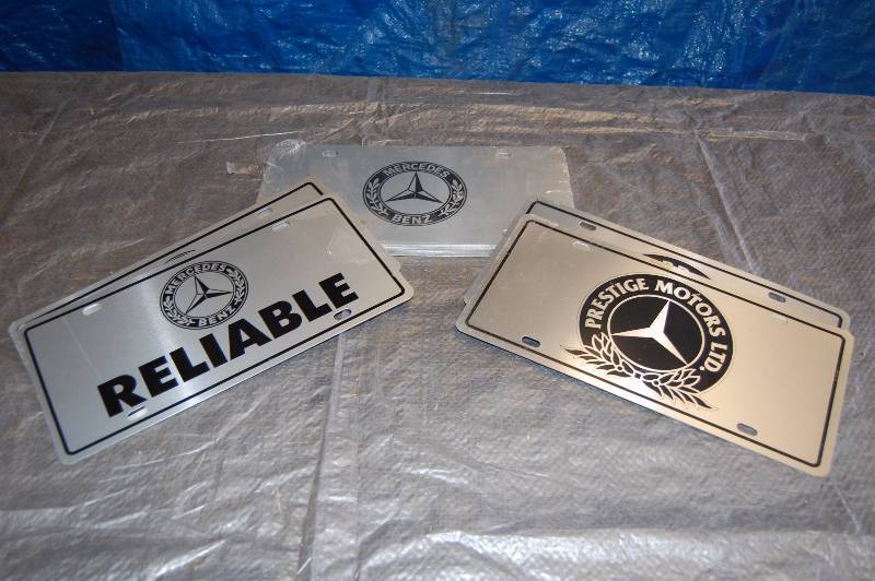 lot 98 image: Metal Advertising License Plates