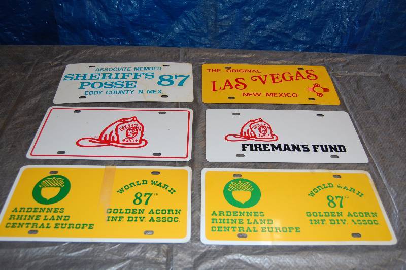 lot 99 image: Metal Advertising License Plates