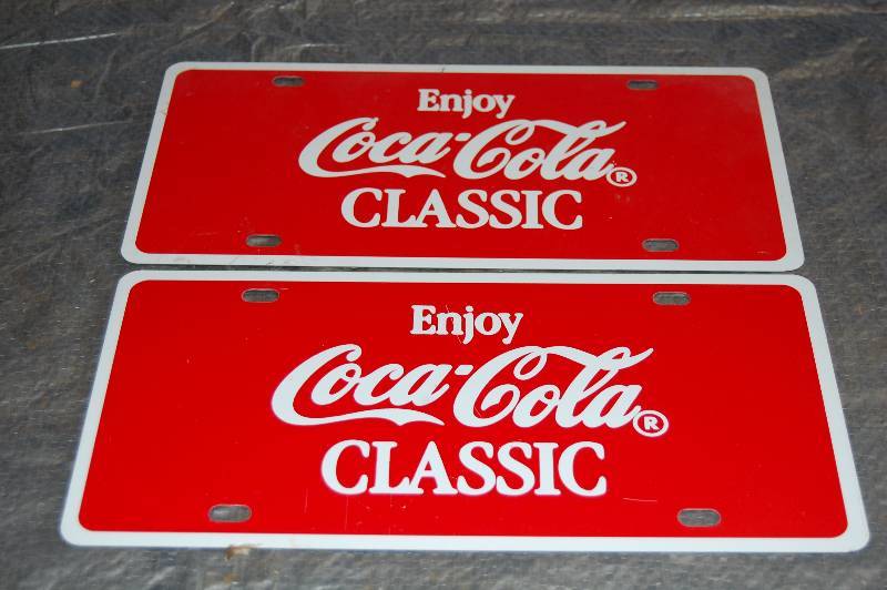 lot 100 image: Metal Advertising License Plates