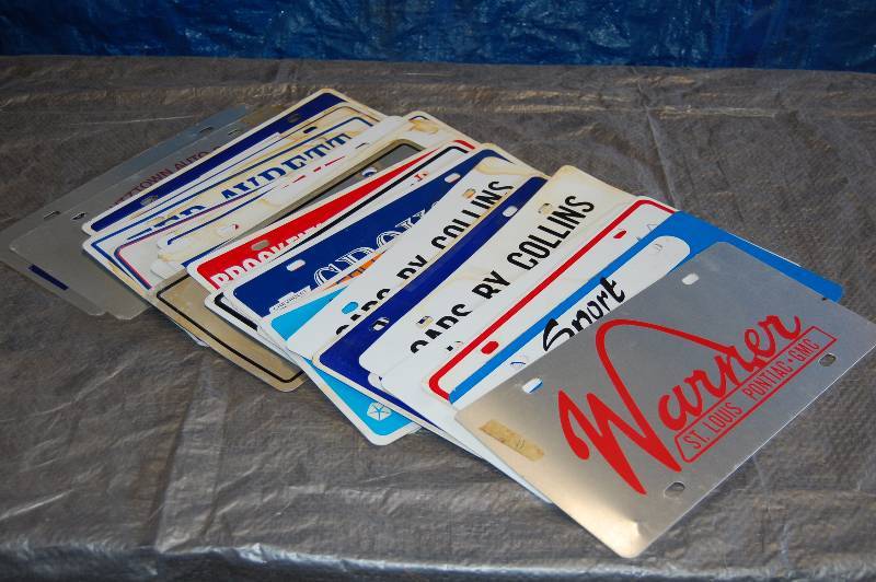 lot 102 image: Metal Advertising License Plates