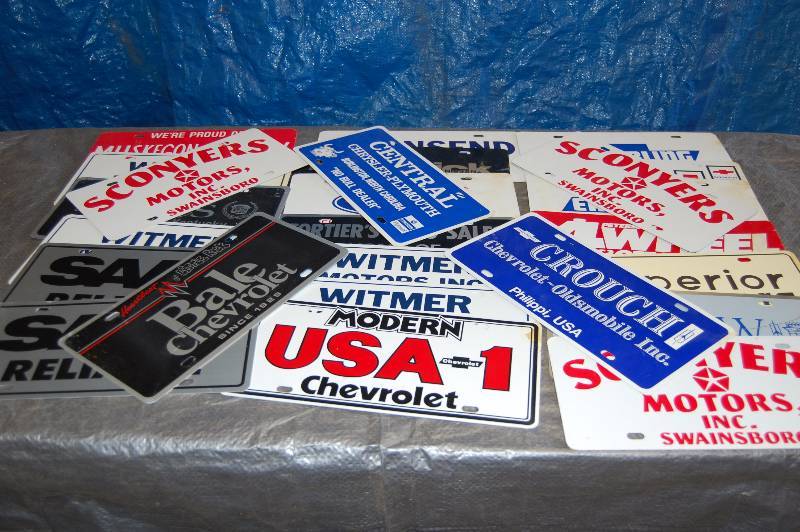 lot 103 image: Metal Advertising License Plates
