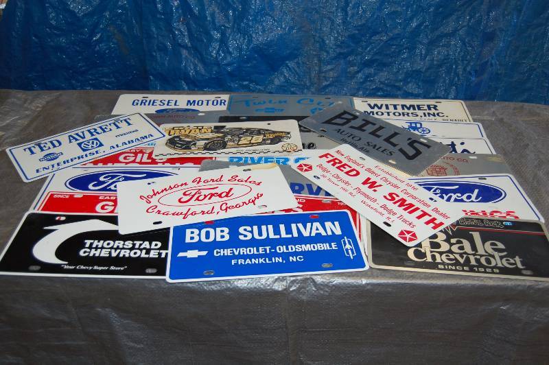 lot 104 image: Metal Advertising License Plates