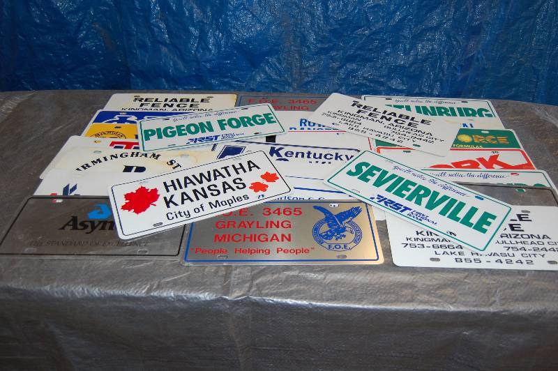 lot 106 image: Metal Advertising License Plates
