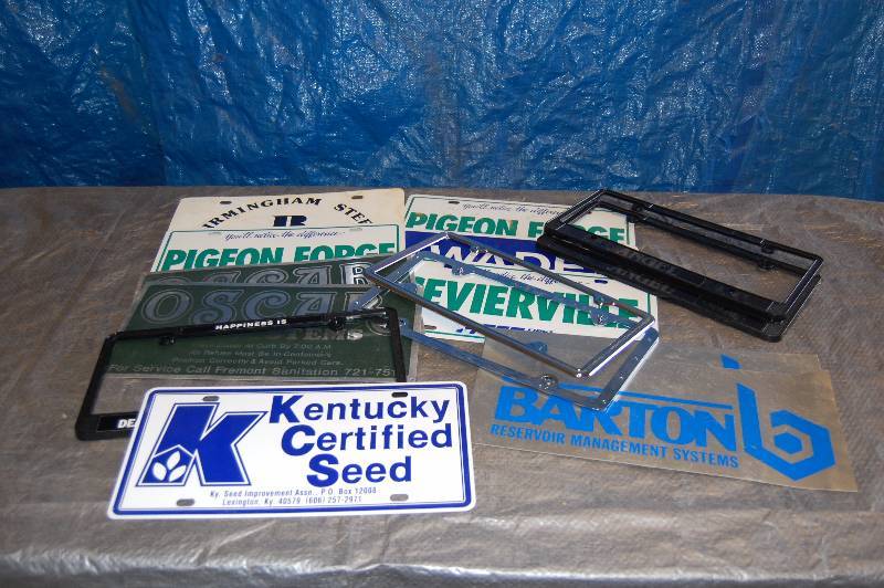 lot 107 image: Metal Advertising License Plates and Plastic License Plate Covers