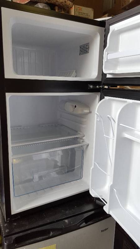lot 12 image: Haier HC32TW10SB Mini 3.2 Cu Ft Refrigerator light  scratches tested works well