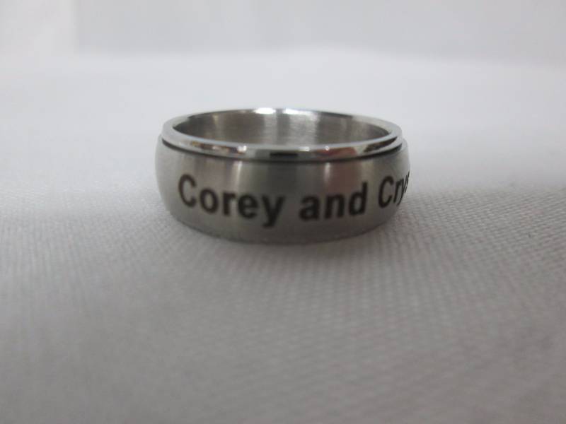 lot 77 image: Stainless Steel Ladies Personalized Spinner Ring