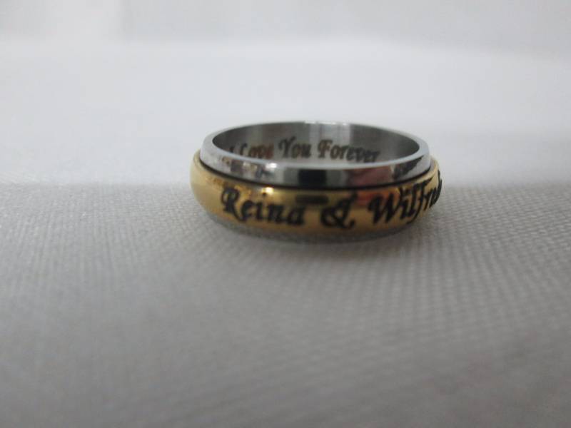 lot 85 image: Ladies Stainless Steel Personalized Couples Spinner Band