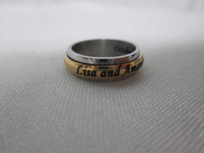 lot 88 image: Ladies Stainless Steel Personalized Couples Spinner Band