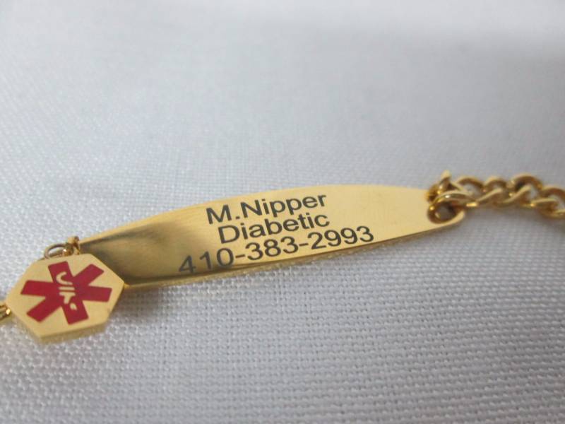 lot 90 image: Ladies Goldtone Steel Medical ID Bracelet