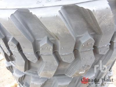 lot 16 image: NEW 4 X 10X16.5 10 PLY SKID STEER TIRES WITH RIM GUARD