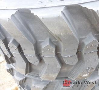 lot 19 image: NEW 4 X 12X16.5 12 PLY SKID STEER TIRES WITH RIM GUARD