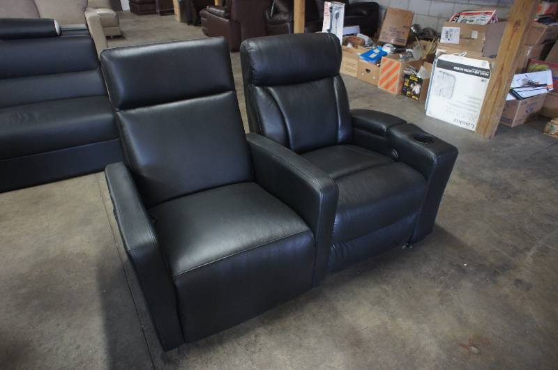 lot 26 image: 60 High End Black Leather Theatre Chairs. Dimensions 60W X 34D X 39T