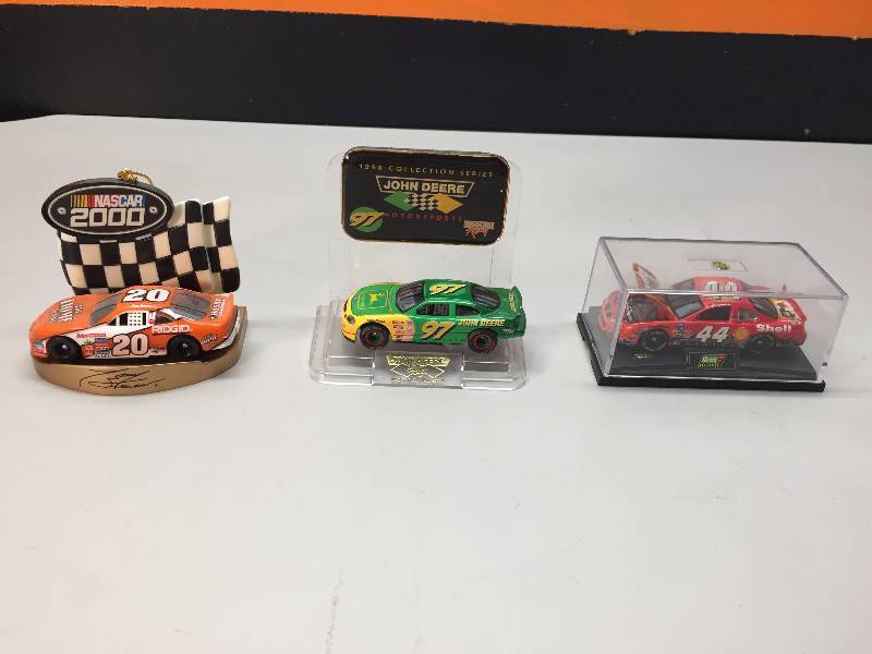lot 7 image: NASCAR SHOT GLASS, MINI ORNAMENTS, PLAYING CARDS, LEGOS AND COCA COLA CAR