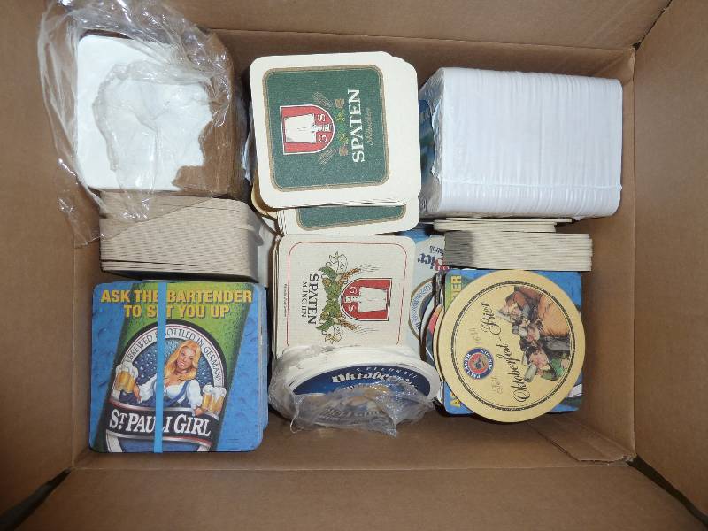 Box of beer coasters - a couple hun...