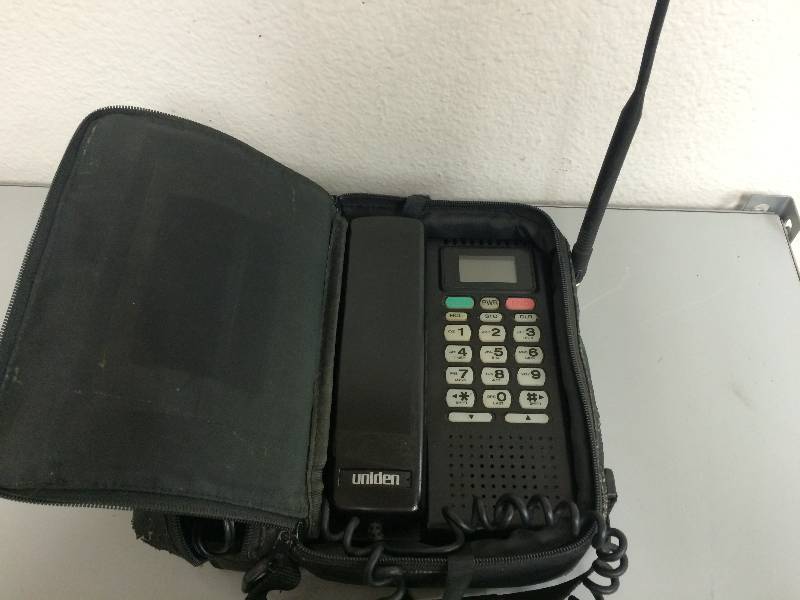 lot 23 image: Uniden Mobile Telephone and Camera