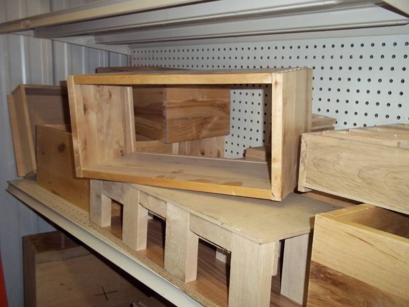 lot 245 image: Shelf full of Wood risers and wood box frames