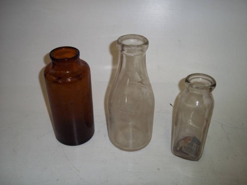 lot 310 image: Milk bottles and brown bottle