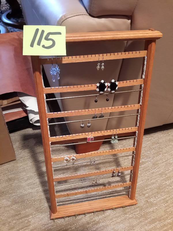 lot 115 image: Wood Ear Ring rack.. Earrings on it included