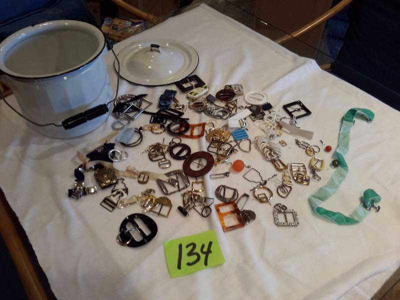 lot 134 image: Porcelain Thunder Bucket of Belt Buckles.. Bucket included