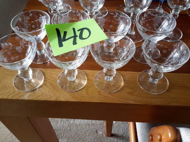 lot 140 image: 8 Small champagne glasses.  Etched leaf design