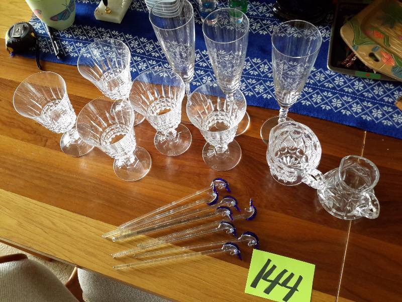 lot 144 image: 5 crystal wine glass, 3 champagne flutes, 8 glass unicorn stir sticks, Crystal Cream and Sugar.