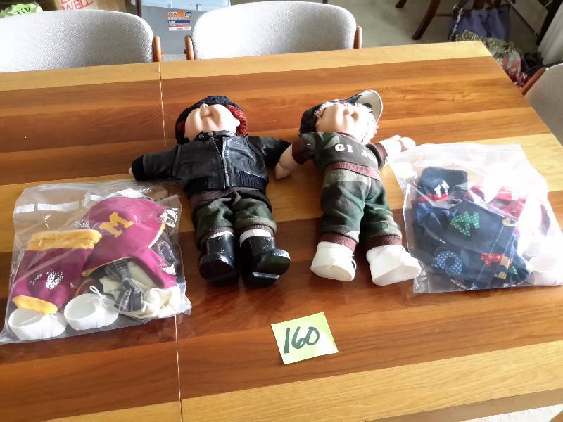 lot 160 image: 2, Cabbage Patch Kids. .BOYS.. Clothes as shown, including U of M outfits and accessories.
