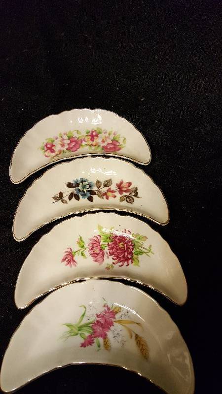 Lot of four Moon shaped dishes