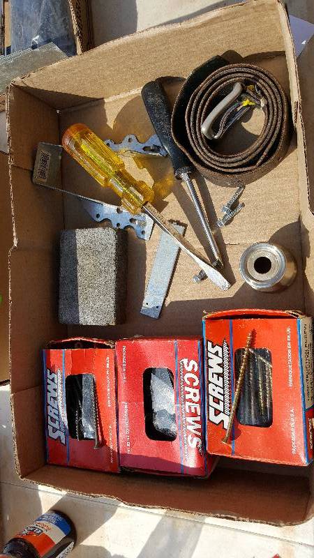 3 boxes of screws, belt, and screw drivers