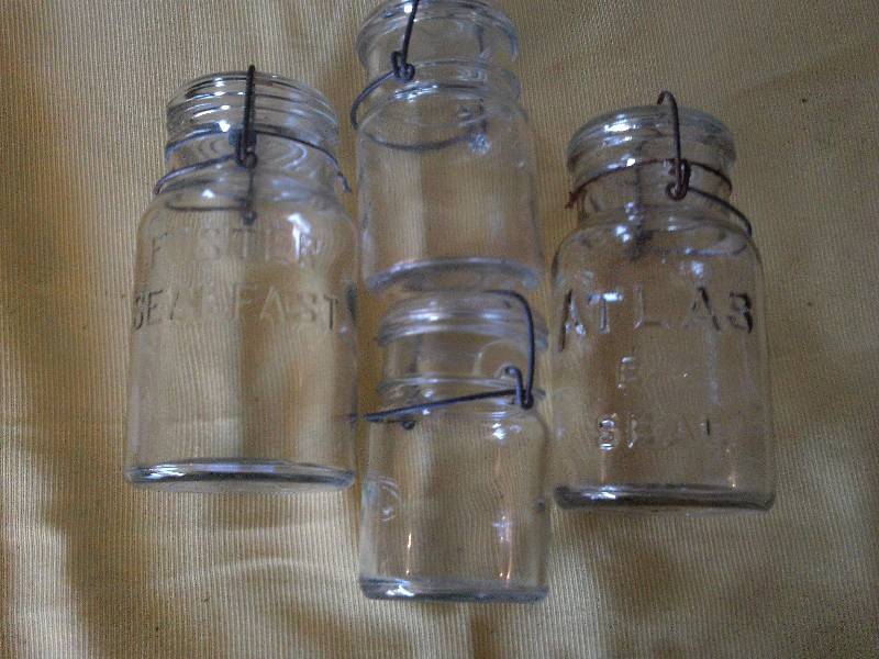 4 VINTAGE CLEAR GLASS JARS
