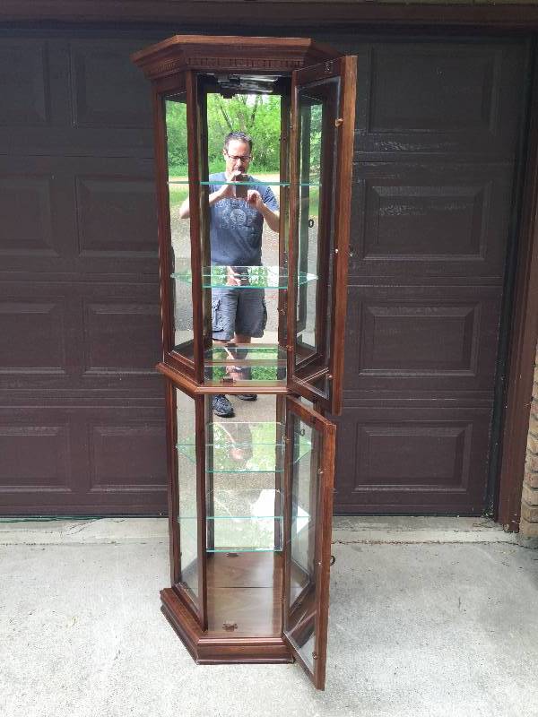 lot 55 image: New High Quality Gorgeously Elegant Pulaski Furniture Rich Brown Lighted Curio Cabinet With Mirrored Back, Two Doors & Adjustible Shelving - This Had Been Stored - Never Used With the Glass Shelves Wrapped - Retails For About $500.00