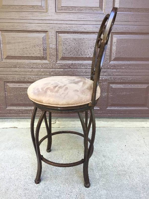 lot 53 image: Pastel Furniture Magnolia Moccasin Suede Upholstered Swivel Barstool Scrolled Bronze Colored Iron Breakfast Bar Chair - Current Retail $478.00 - Very Nice Condition