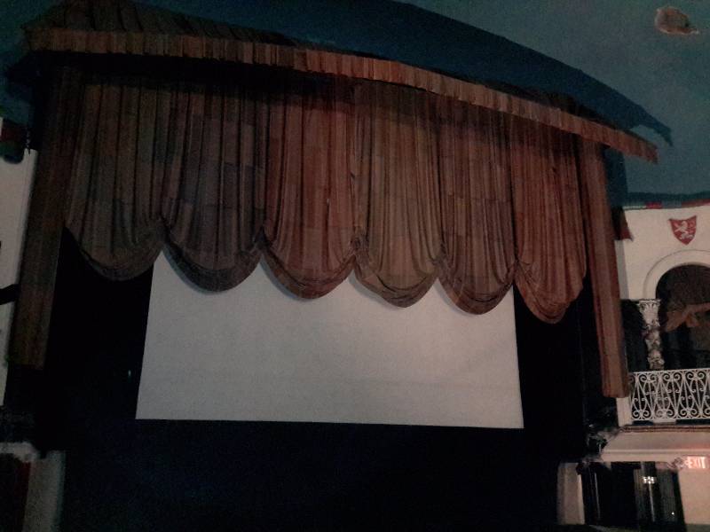 25ft x 25 ft screen and surrounding Curtains