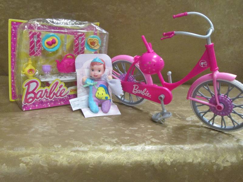 lot 90 image: Barbie Bike, Breakfast set, & Baby ...