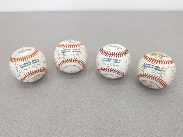 lot 25 image: Four Original MN Twins Team-Signed Baseballs, 1996-1999