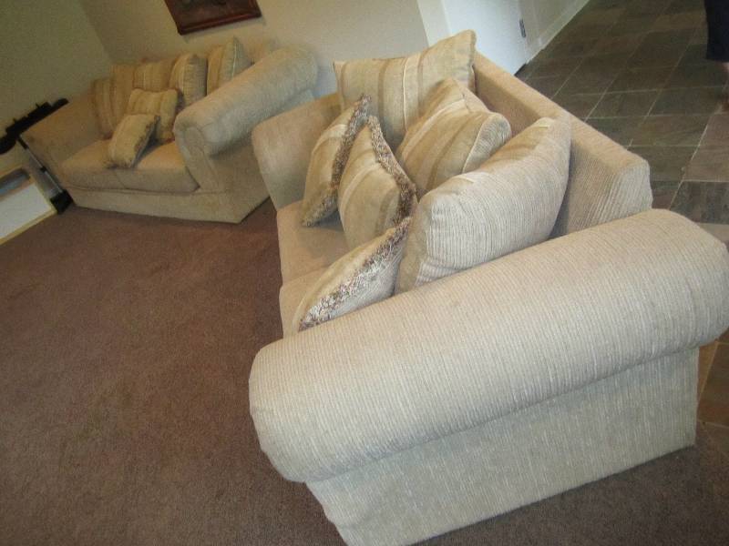 Pair of couches, complete with pill...